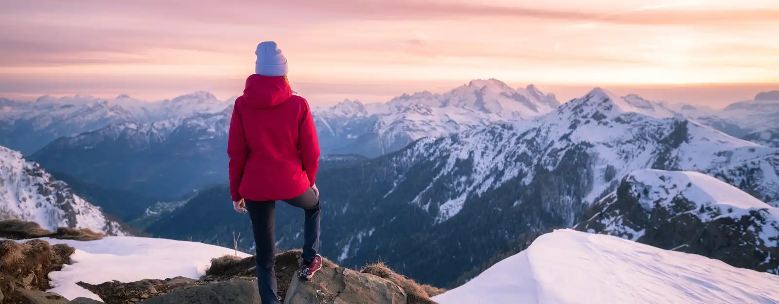 woman standing on top of mountain